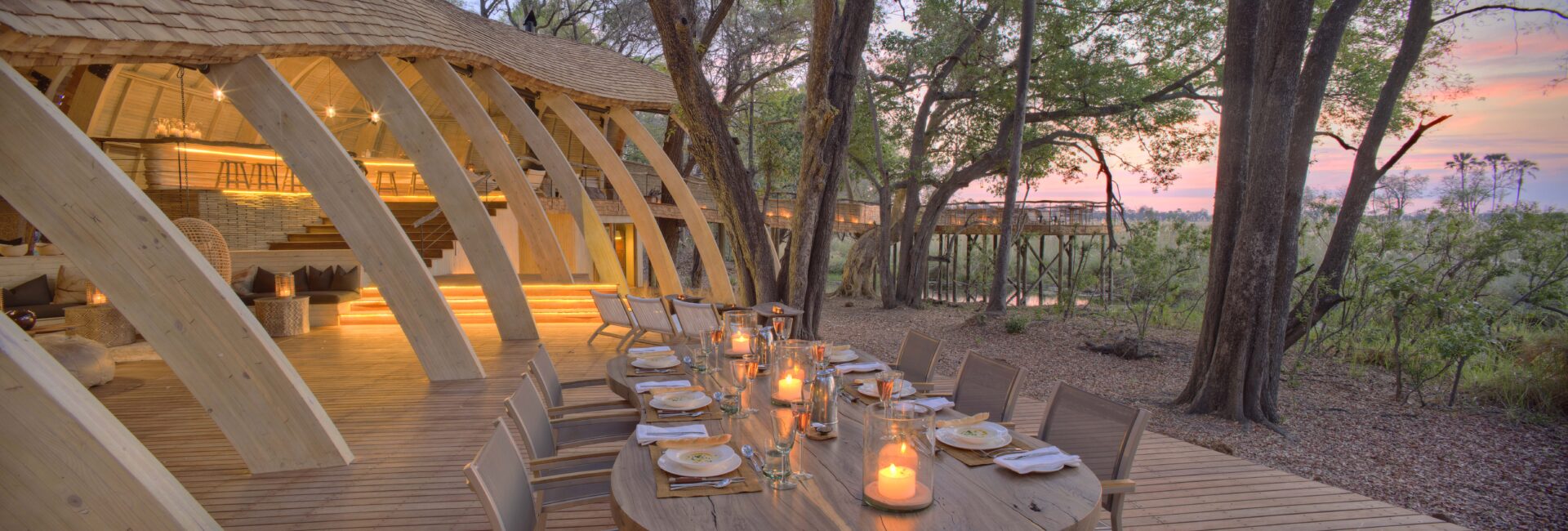 Botswana-Sandibe-Guest-Area-dinner-on-deck-at-sunset (1)